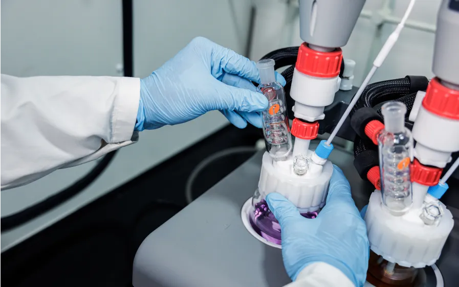 Honour scientist performing precision chemistry for CDMO services