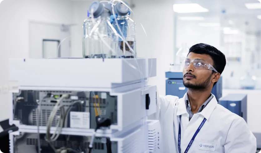 Honour scientist working with advanced equipment for cutting edge research 
