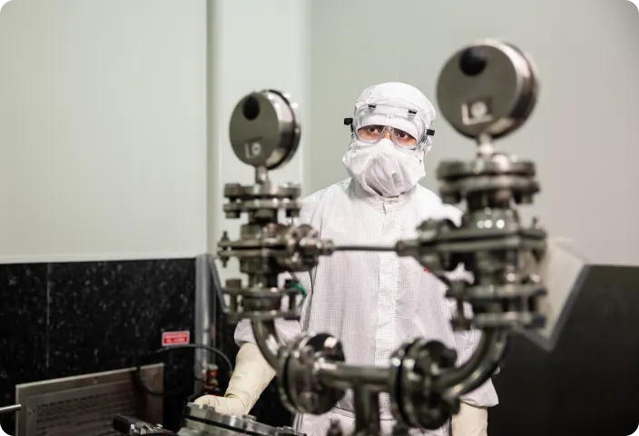 Engineers managing large-scale chemical production in a controlled environment